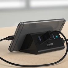 Load image into Gallery viewer, ORICO SHC-U3 ABS Material Desktop 4 Ports USB 3.0 HUB with Phone / Tablet Holder &amp; 1m USB Cable &amp; LED Indicator, SHC-U3