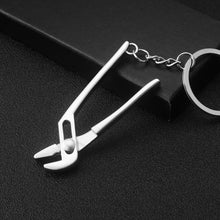 Load image into Gallery viewer, 10 PCS Tool Metal Keychain Car Key Ring Pendant, H-540 Activity Wrench, H-389 Hex Wrench, H-391 Glossy Ax, H-388 Thread Ax, H-395 Double Head Wrench, H-405 Double Row Saw, H-402 Hand Saw, H-541 Crooked Nose Pliers, H-399 Pliers, X-396 Vise, H-556 Shove...